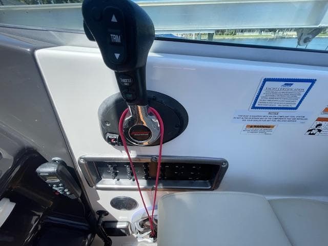 Control panel of a 2019 Monterey 295 boat with throttle and trim controls.