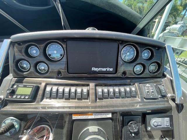 Control panel of a 2019 Monterey 295 boat with Raymarine display and gauges.