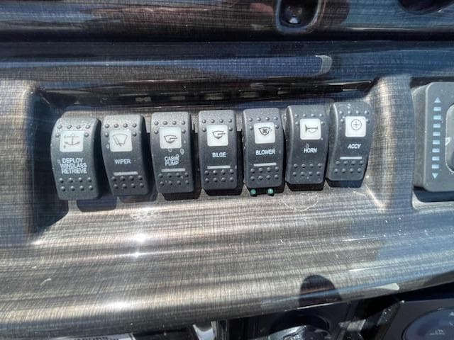 Control panel of a 2019 Monterey 295 boat with labeled switches.