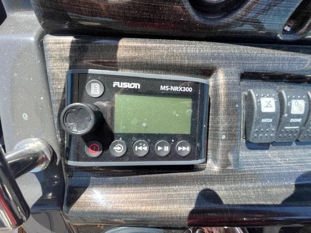 Fusion MS-NRX300 marine stereo on 2019 Monterey 295 dashboard.