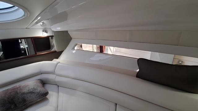 Luxurious interior of a 2019 Monterey 295 boat with plush seating and modern design.