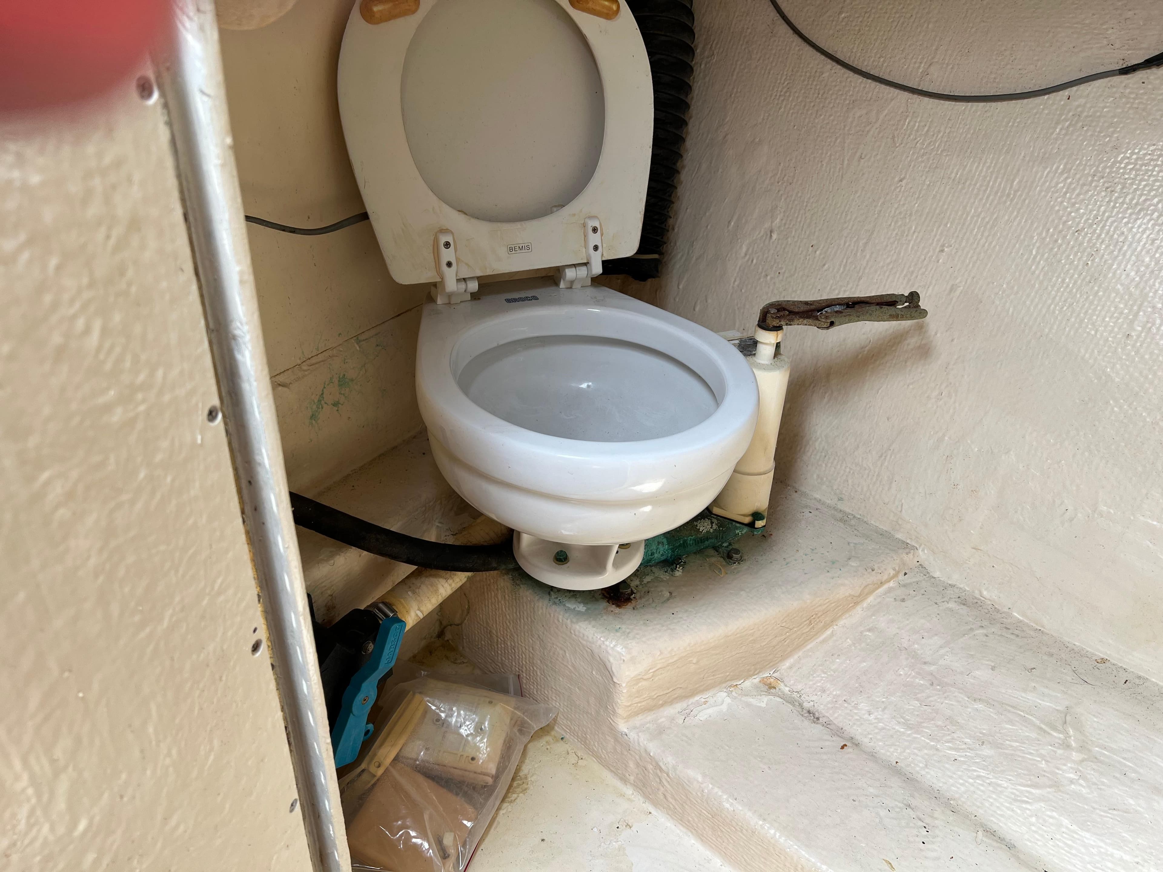 Boat toilet in 2000 Stuart Angler 32 Center Console/Cutty, white interior.