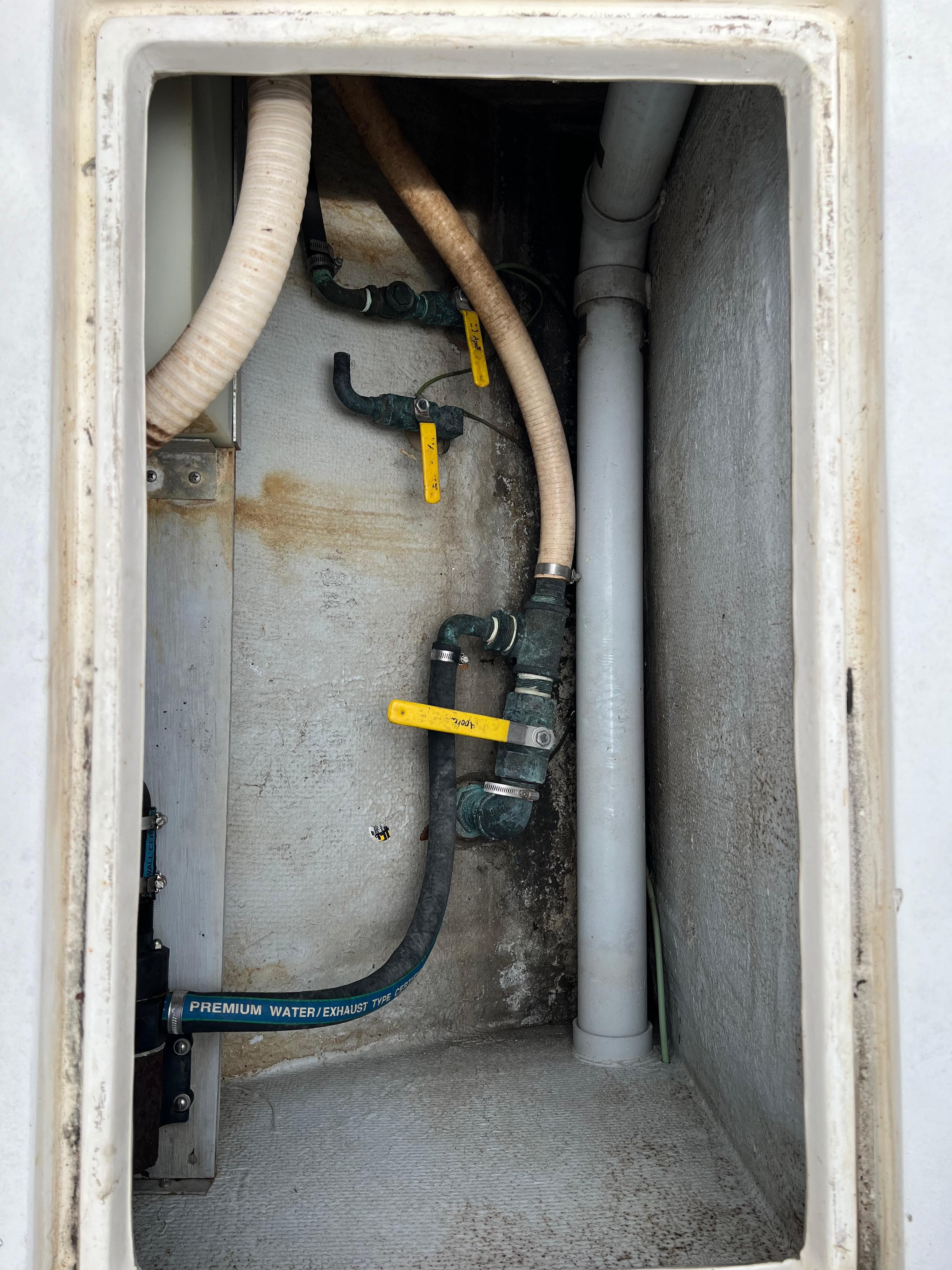 Interior view of a 2000 Stuart Angler 32 Center Console boat plumbing system.