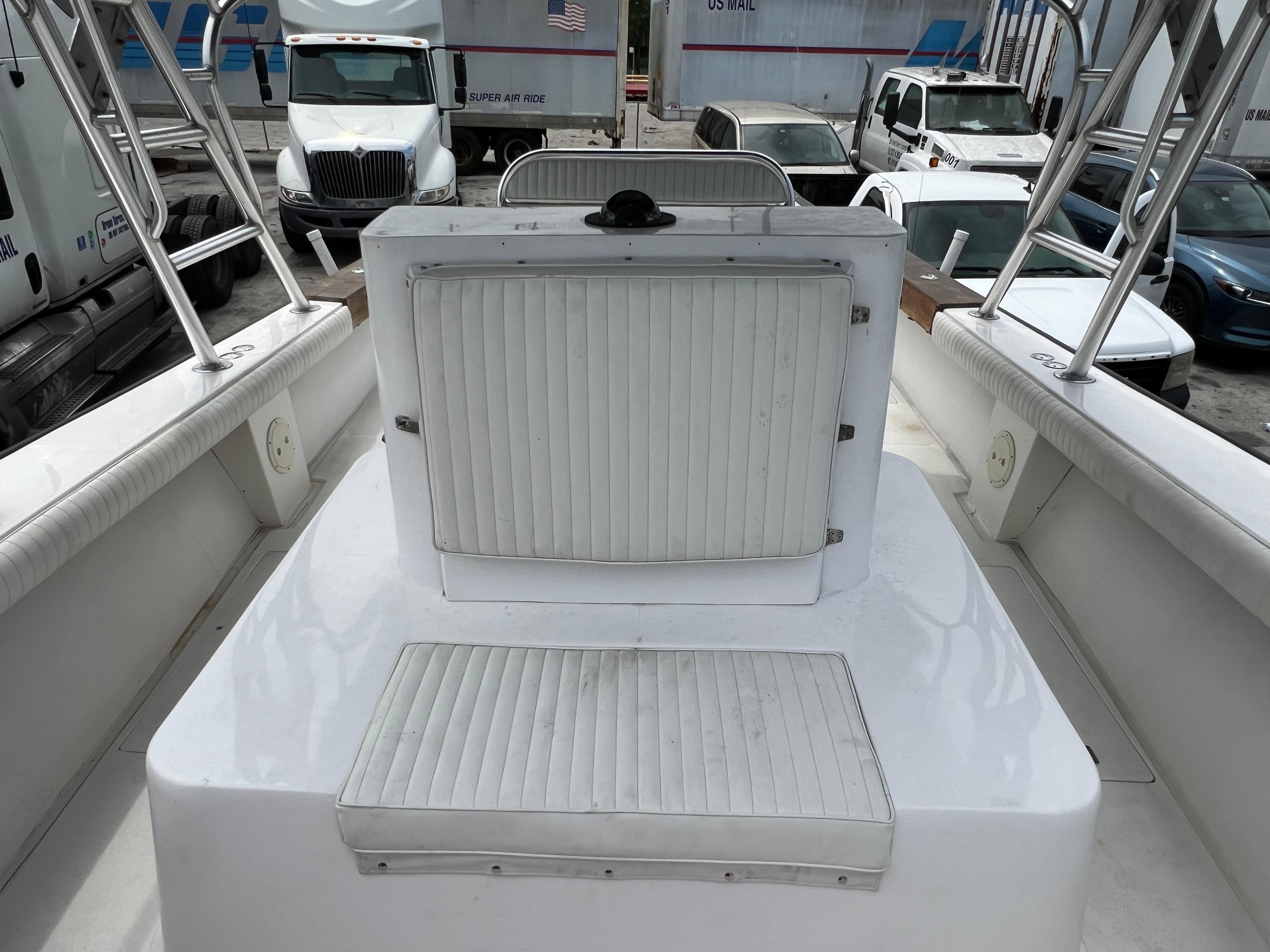 2000 Stuart Angler 32 Center Console boat interior with seating and storage compartments.
