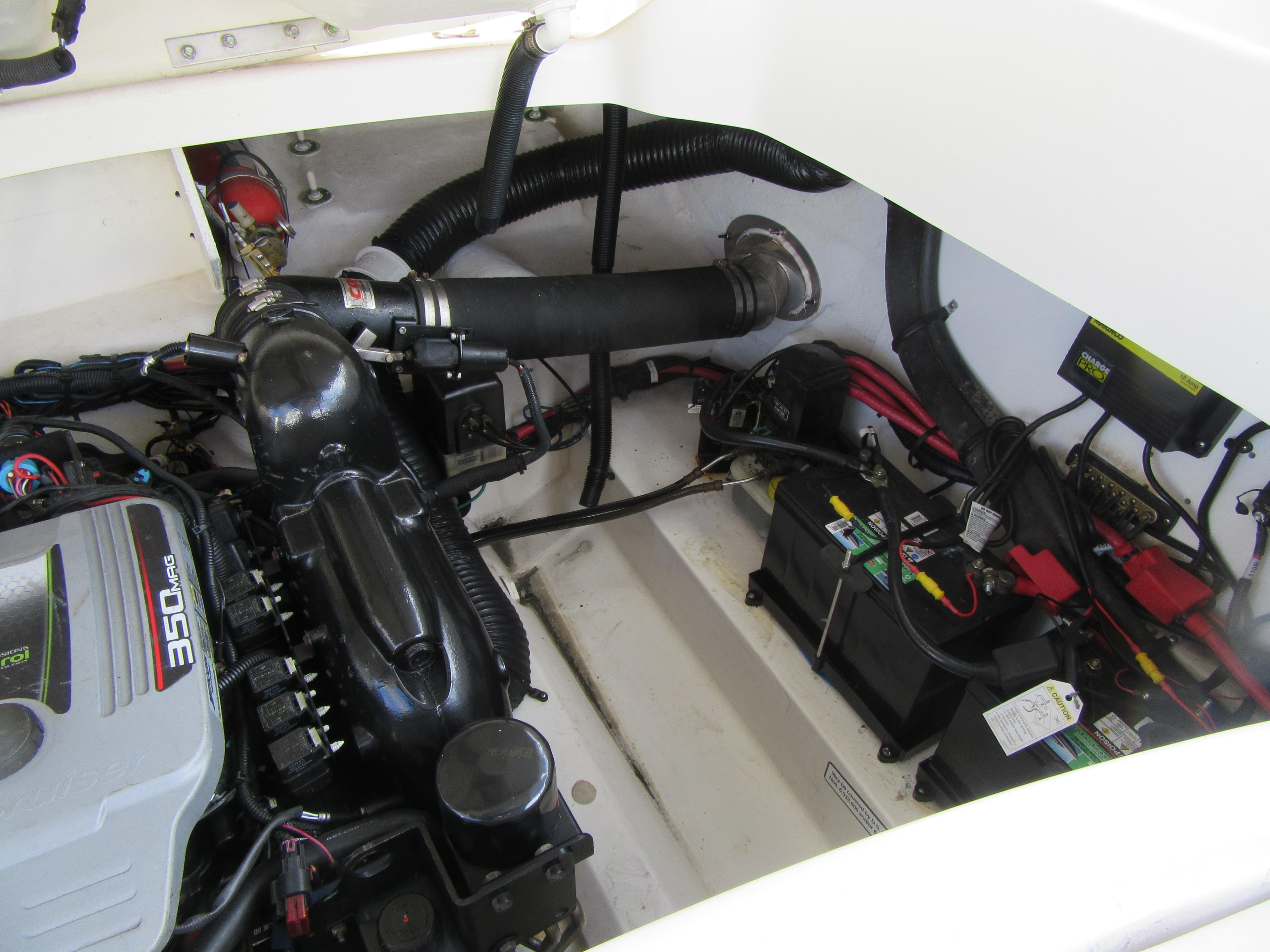 Engine compartment of a 2011 Sea Ray 250 SLX boat, featuring a 350 MAG engine.