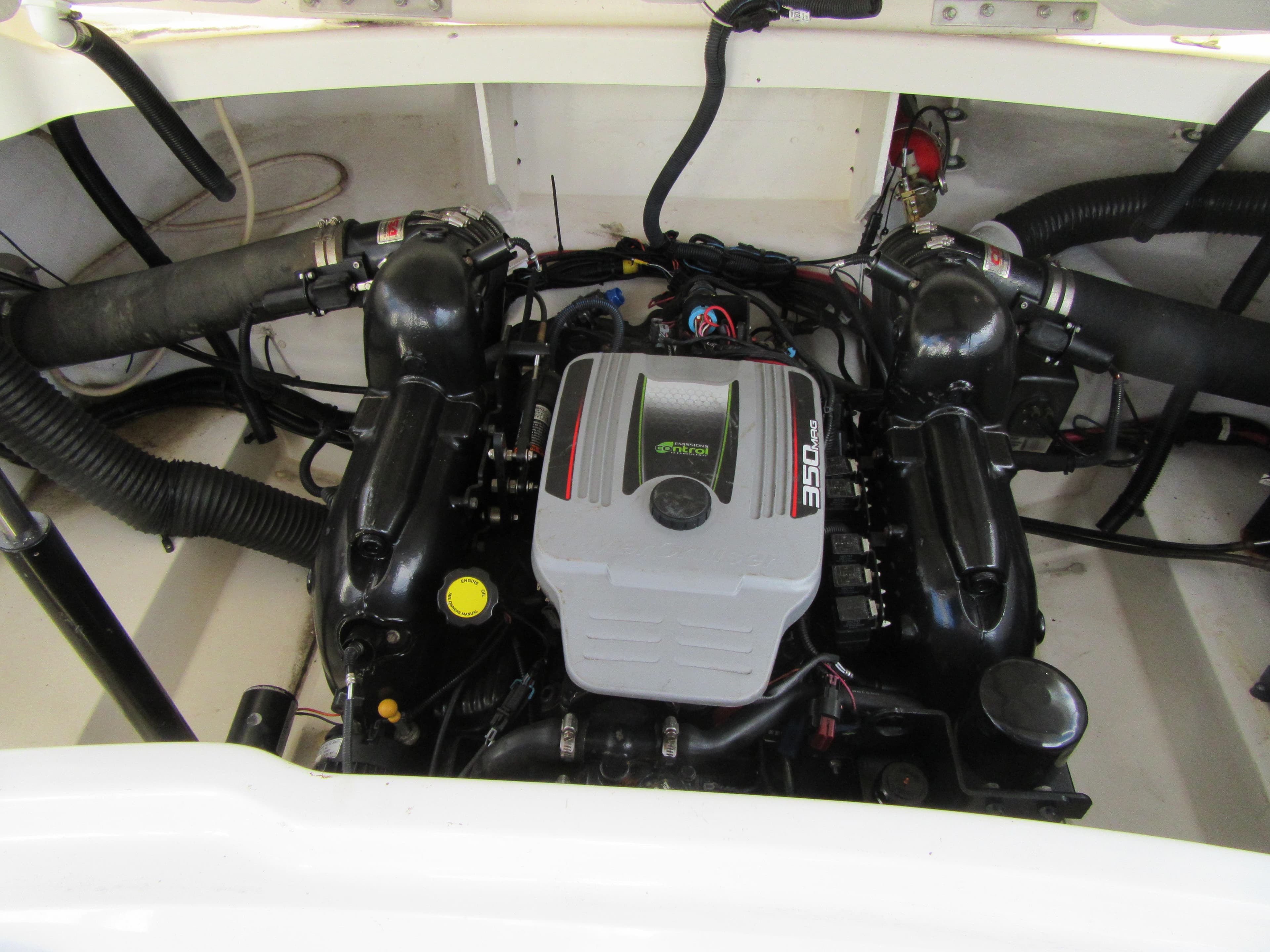 Engine compartment of a 2011 Sea Ray 250 SLX boat, featuring a 350 MAG engine.