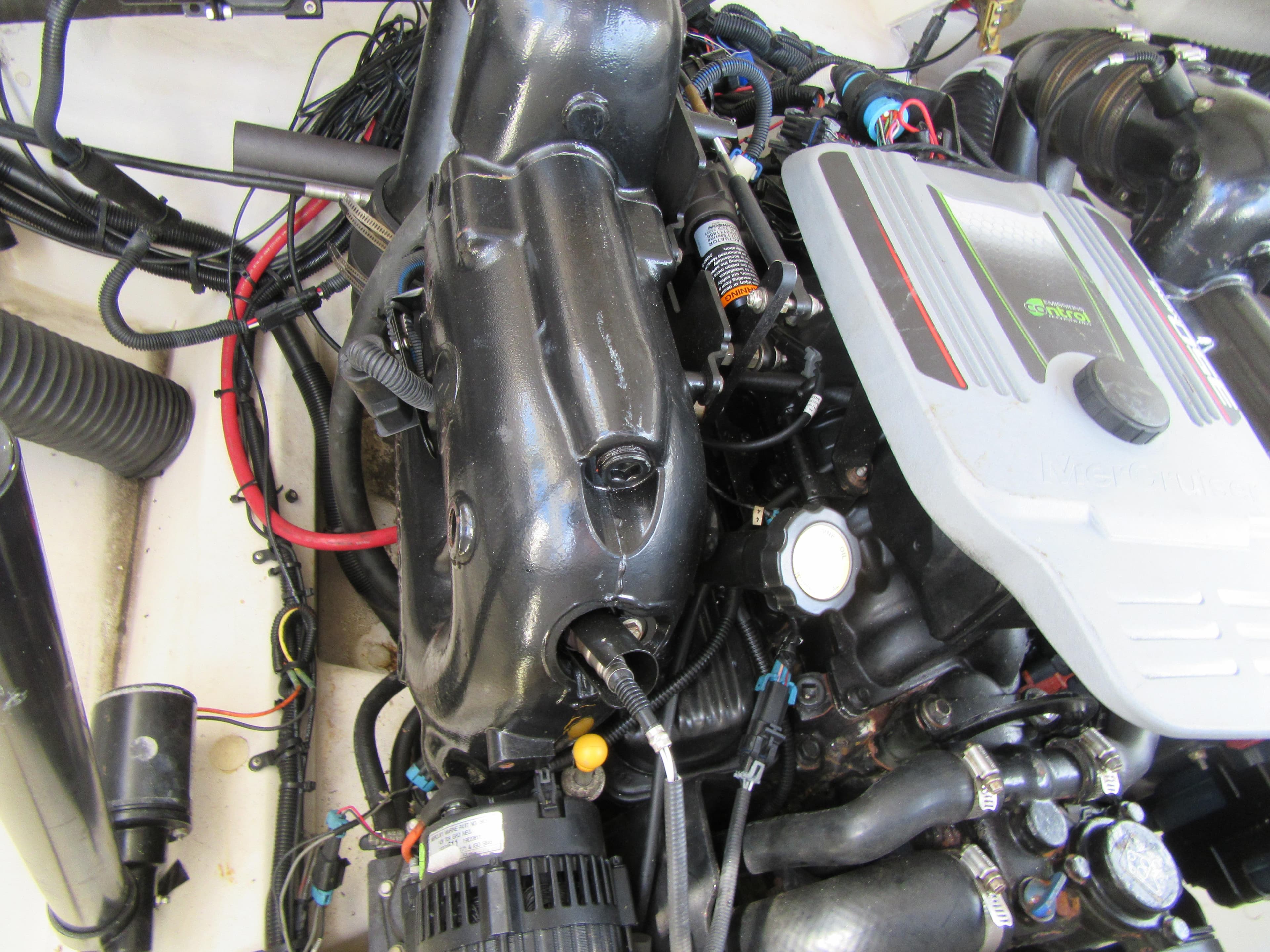 Engine compartment of a 2011 Sea Ray 250 SLX boat, showcasing detailed components.