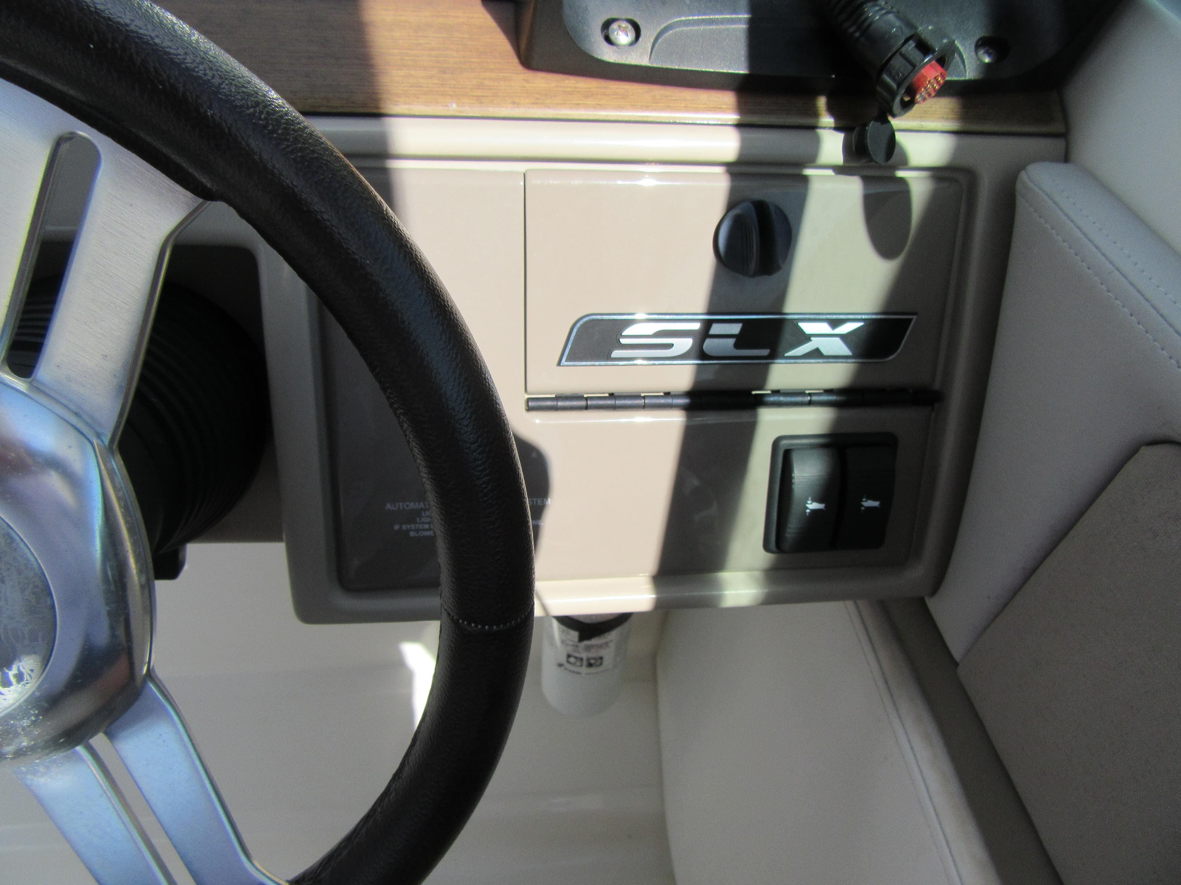 Steering wheel and control panel of 2011 Sea Ray 250 SLX boat.