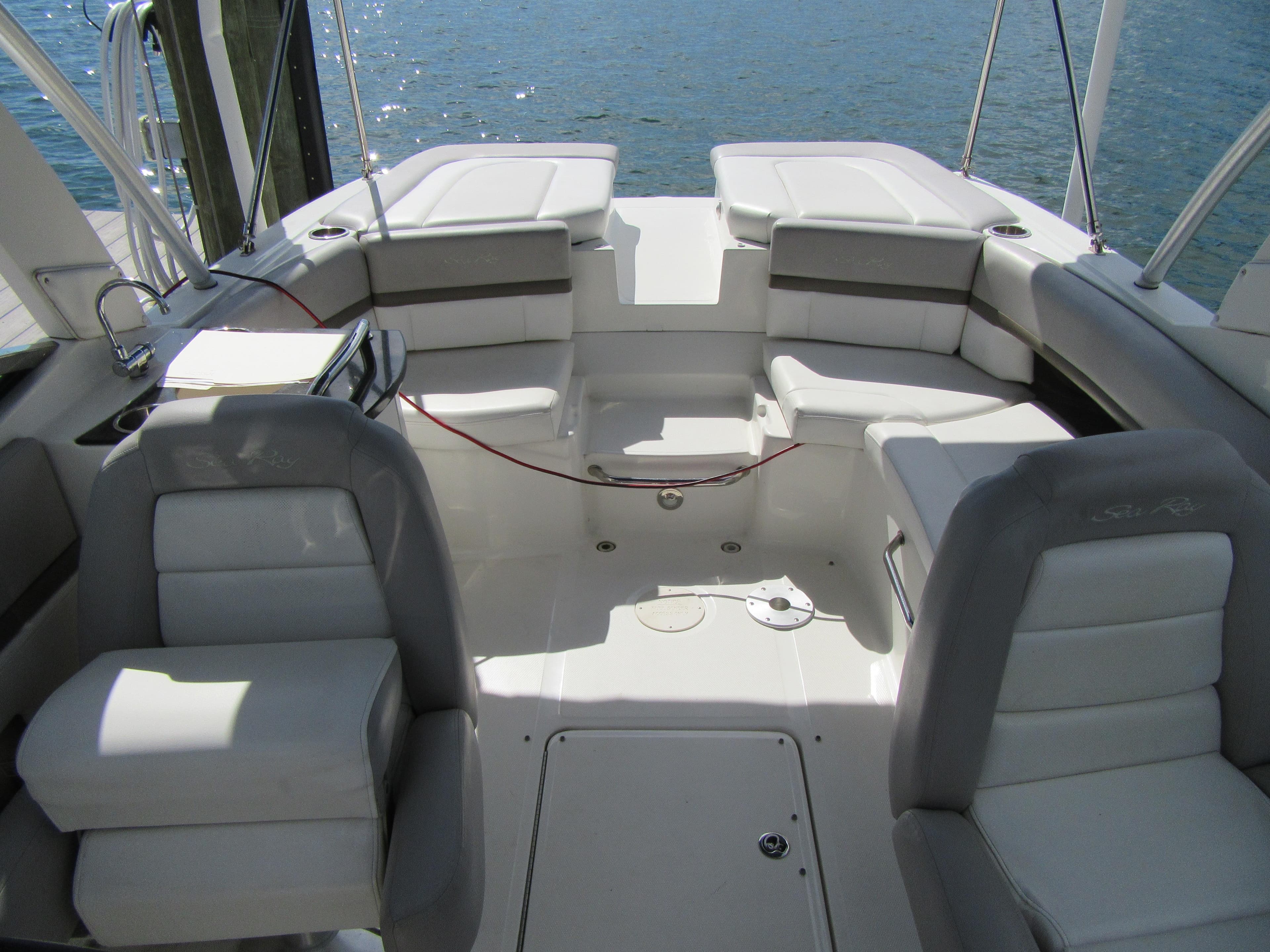 2011 Sea Ray 250 SLX boat interior with white seating and open deck layout.