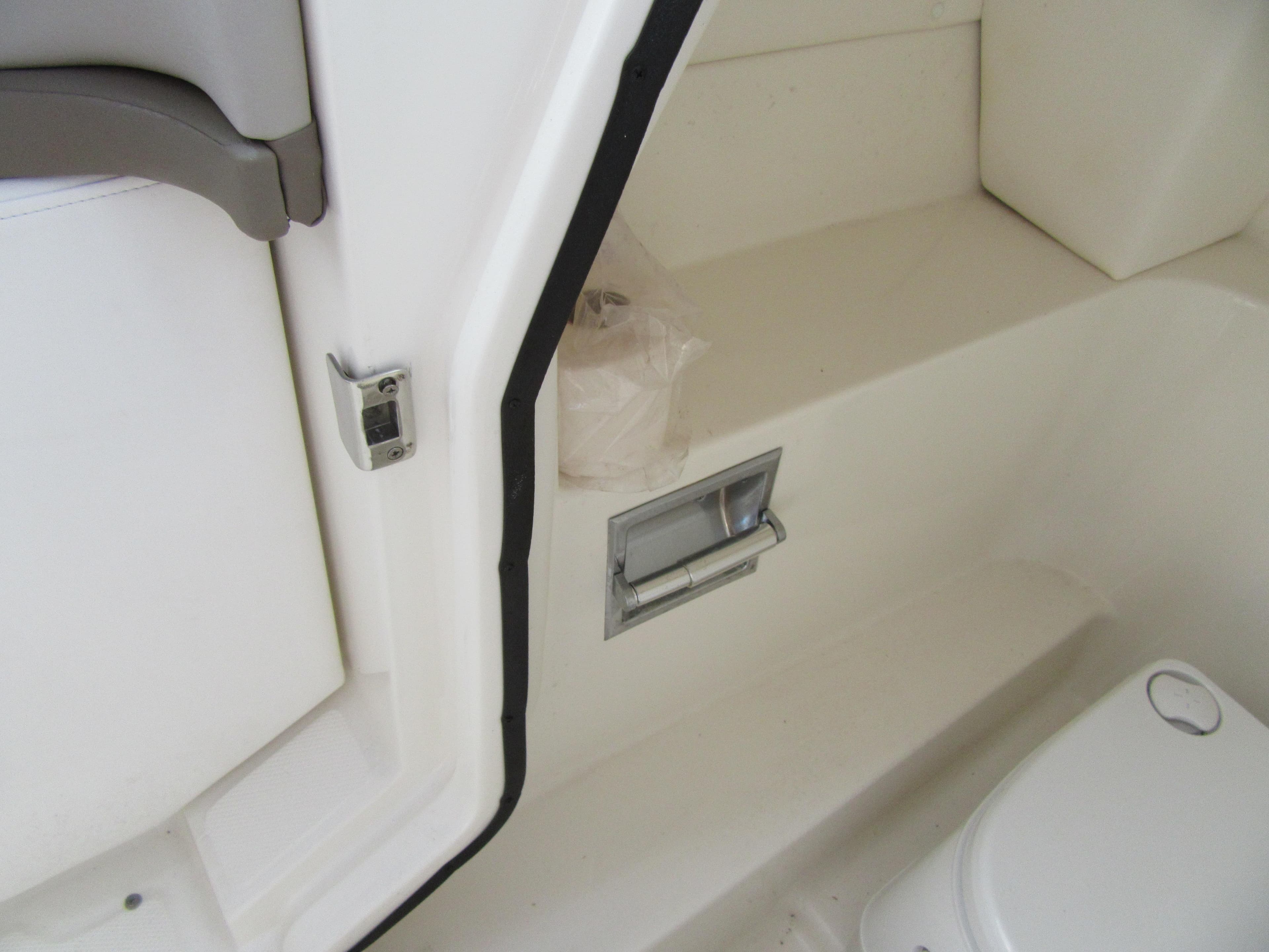 Interior of 2011 Sea Ray 250 SLX boat showing seating and storage area.