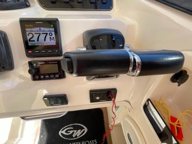 2017 Grady-White 300 Marlin boat dashboard with Garmin display and controls.
