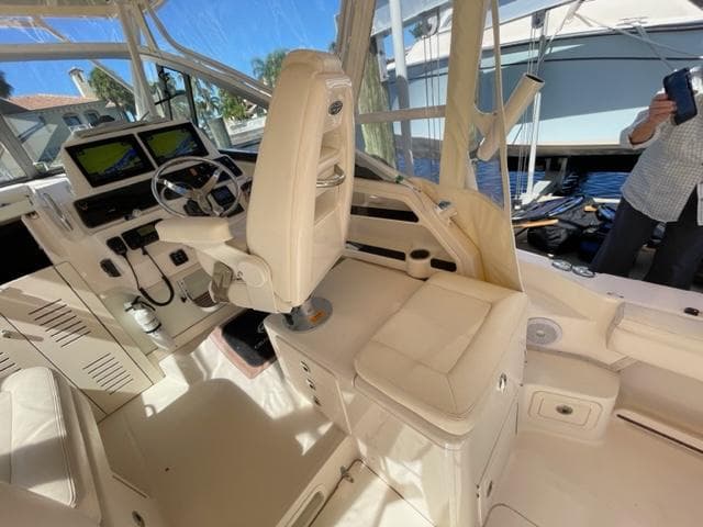 Interior of 2017 Grady-White 300 Marlin boat with helm station and seating.