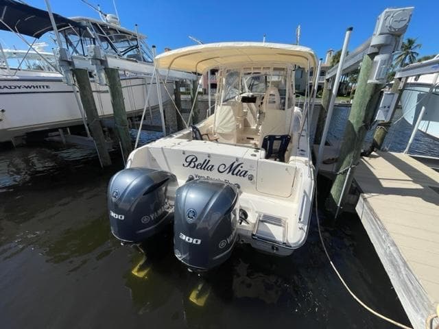 2017 Grady-White 300 Marlin boat docked with twin Yamaha 300 engines.