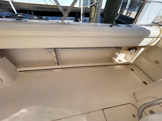 2017 Grady-White 300 Marlin boat interior, clean deck area with storage compartments.