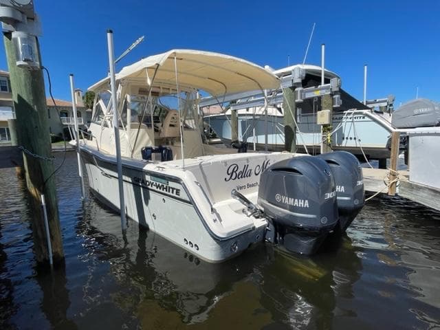 2017 Grady-White 300 Marlin boat docked with twin Yamaha engines.