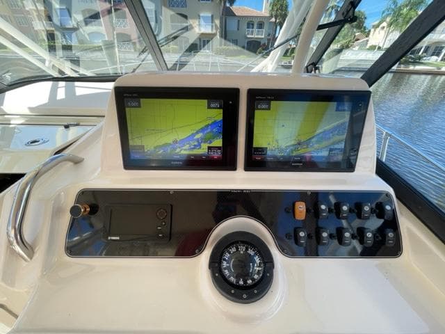Grady-White 300 Marlin 2017 helm with dual navigation screens and compass.