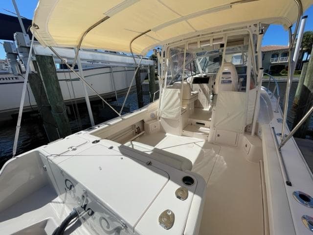 2017 Grady-White 300 Marlin boat interior with canopy, docked at marina.