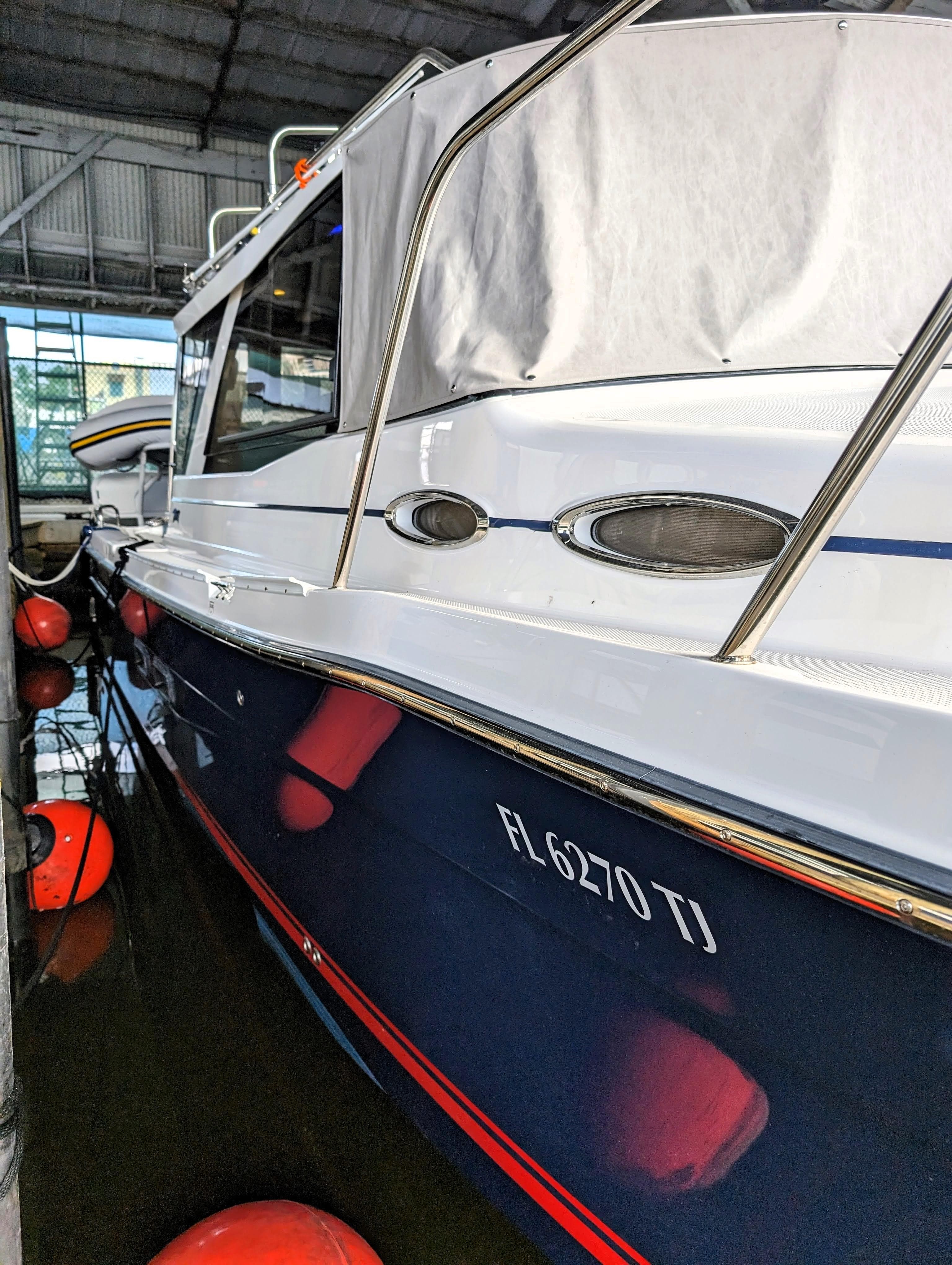 2022 Cutwater C-32 Coupe LE docked in a marina.