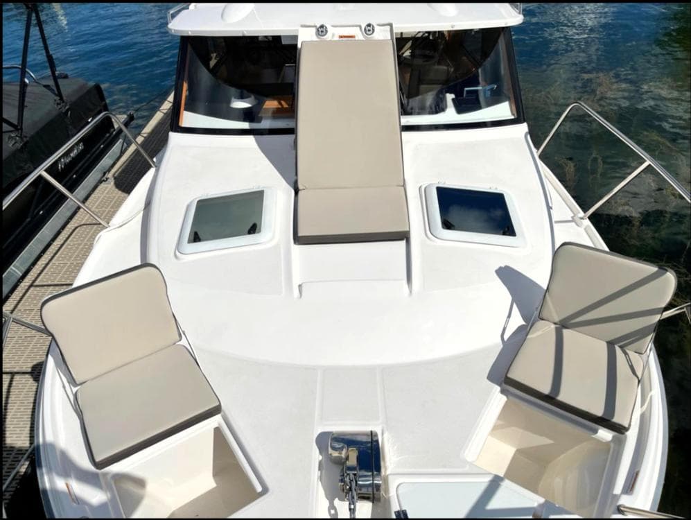 2022 Cutwater C-32 Coupe LE boat deck with seating and hatches.