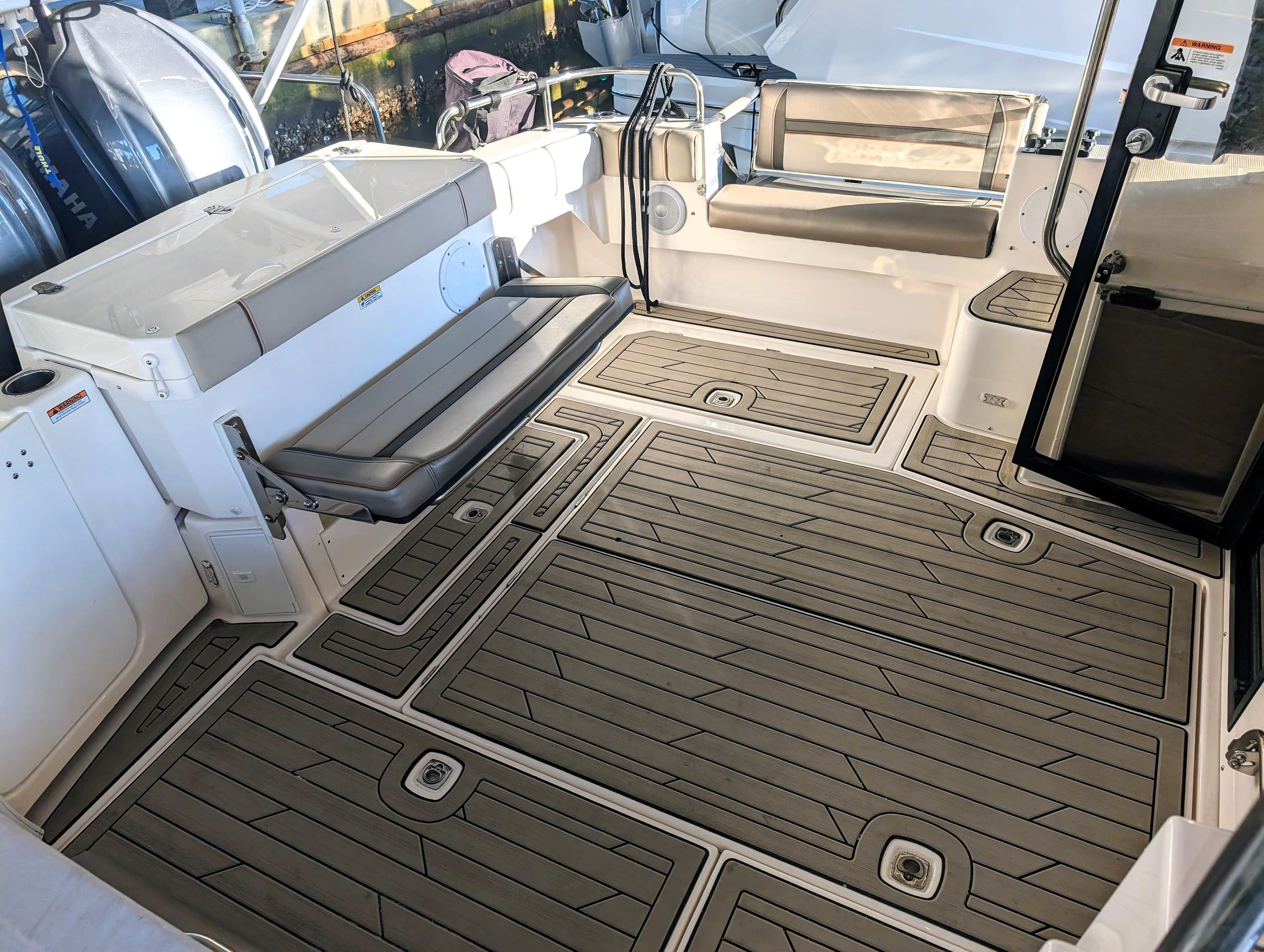2022 Cutwater C-32 Coupe LE boat interior with seating and non-slip flooring.