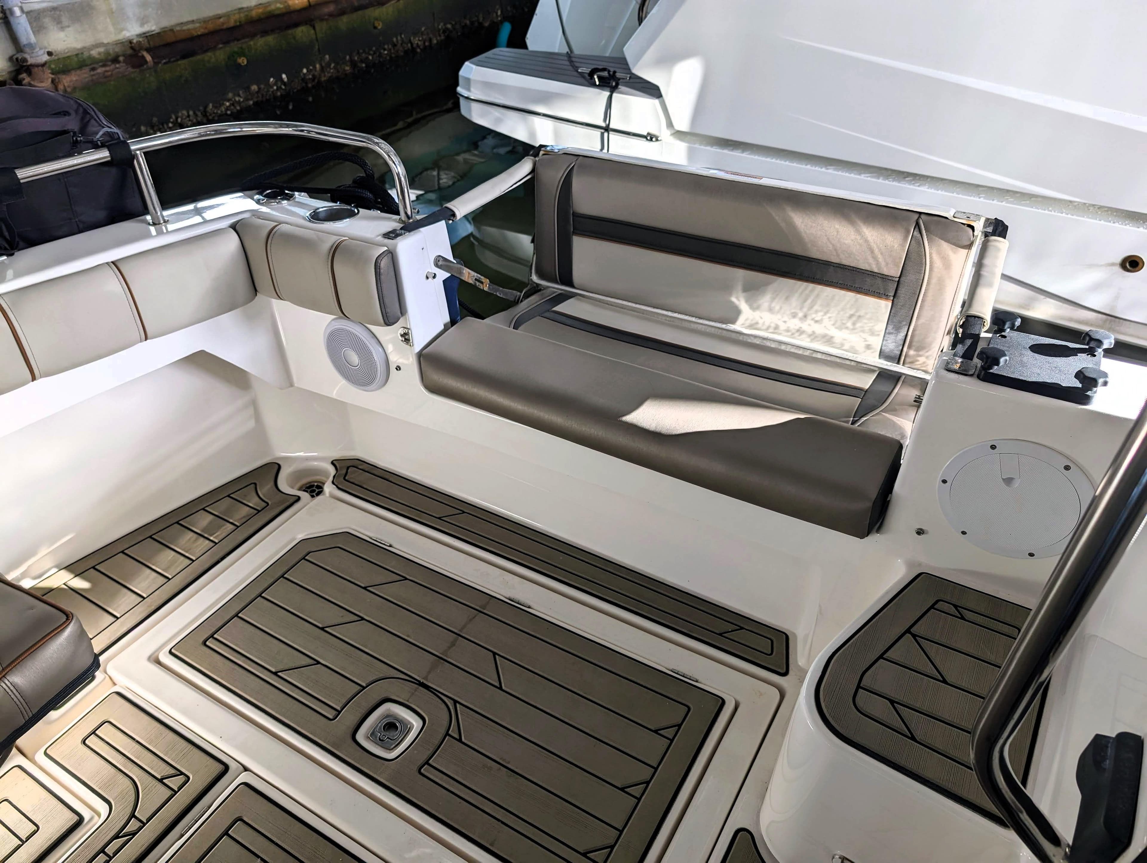 2022 Cutwater C-32 Coupe LE boat interior with cushioned seating and teak flooring.