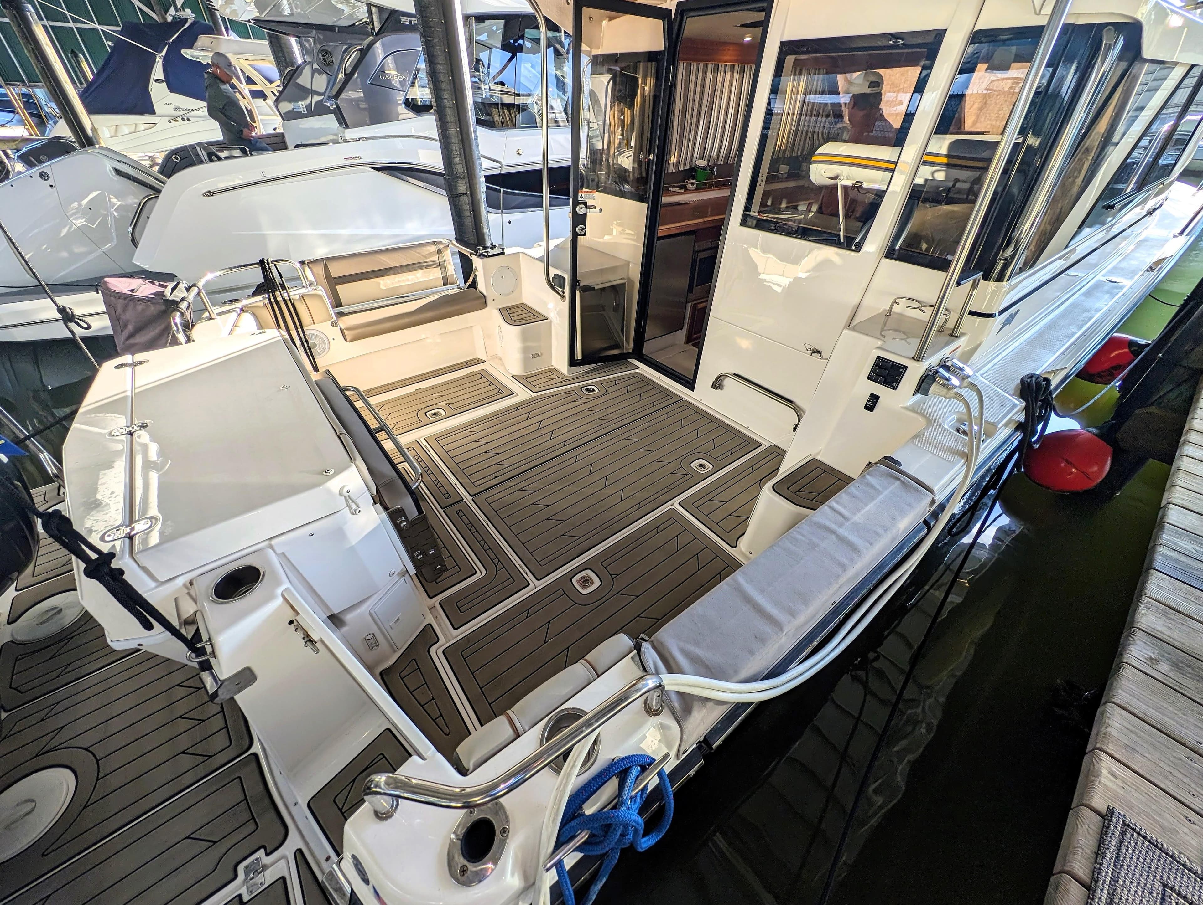 2022 Cutwater C-32 Coupe LE boat interior, docked, with open cockpit and modern design.