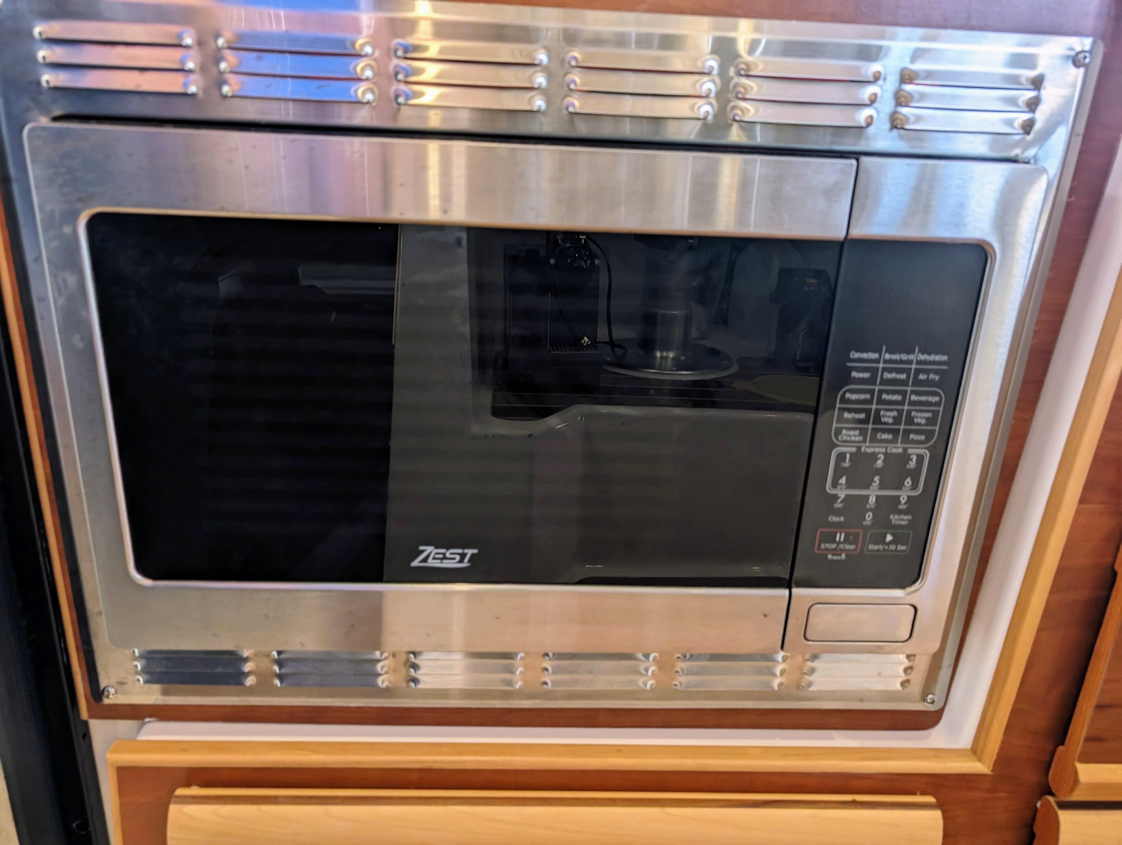 Built-in microwave in 2022 Cutwater C-32 Coupe LE boat kitchen.